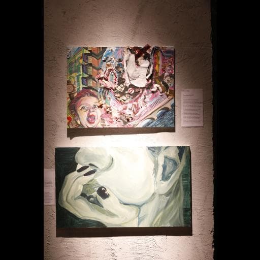 Two paintings on gallery wall, colorful collage above pale green hand holding face.